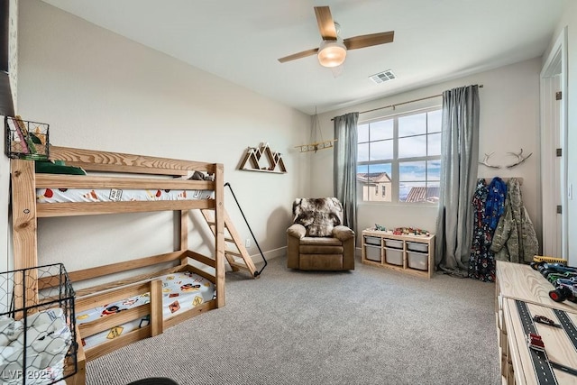 bedroom featuring carpet flooring, ceiling fan, and visible vents