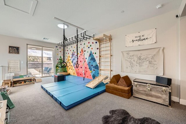 game room with visible vents and carpet flooring