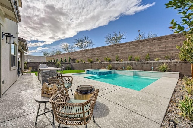 view of swimming pool with a patio, a pool with connected hot tub, and a fenced backyard
