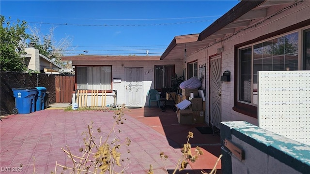 view of patio / terrace featuring fence