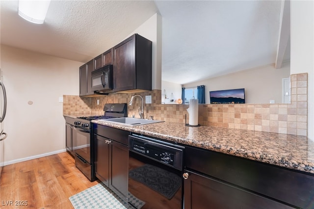 1615 Palora Ave, Las Vegas, NV 89169 - kitchen with black appliances, light wood-style flooring, decorative backsplash, dark brown cabinetry, and a sink