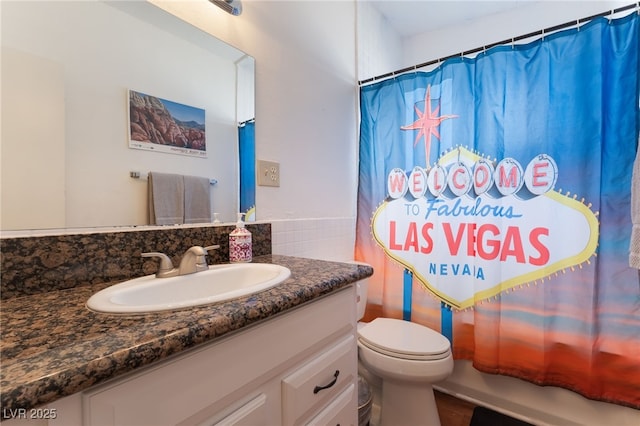 1615 Palora Ave, Las Vegas, NV 89169 - bathroom featuring vanity, toilet, and shower / tub combo with curtain