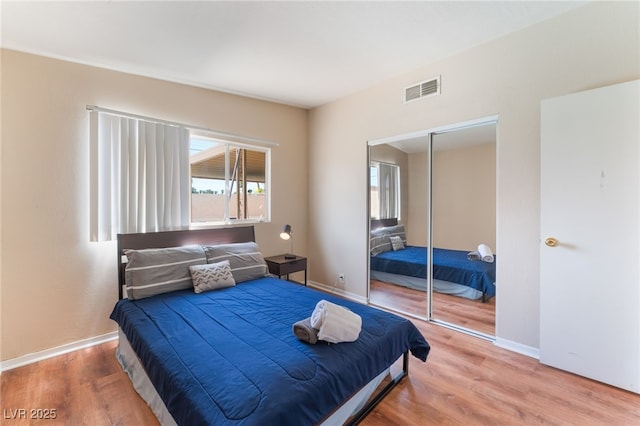 1615 Palora Ave, Las Vegas, NV 89169 - bedroom with wood finished floors, a closet, and baseboards