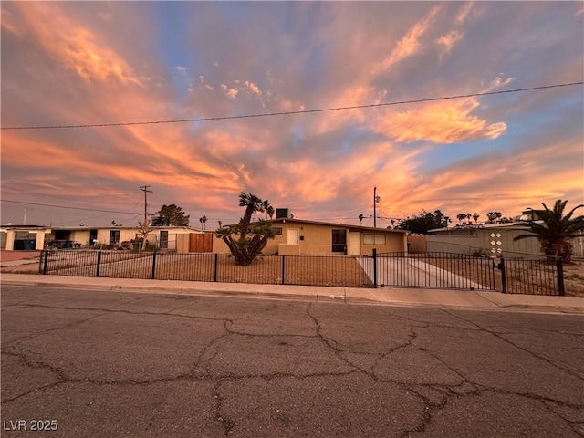 1615 Palora Ave, Las Vegas, NV 89169 - view of front facade featuring concrete driveway, a fenced front yard, and an attached garage