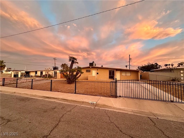 1615 Palora Ave, Las Vegas, NV 89169 - view of front facade featuring a fenced front yard and stucco siding
