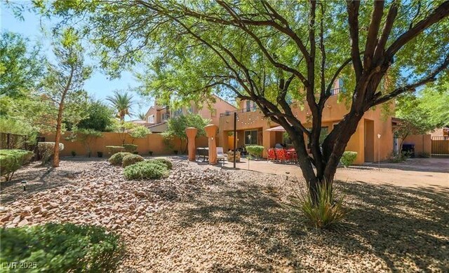 view of yard with a patio area and fence