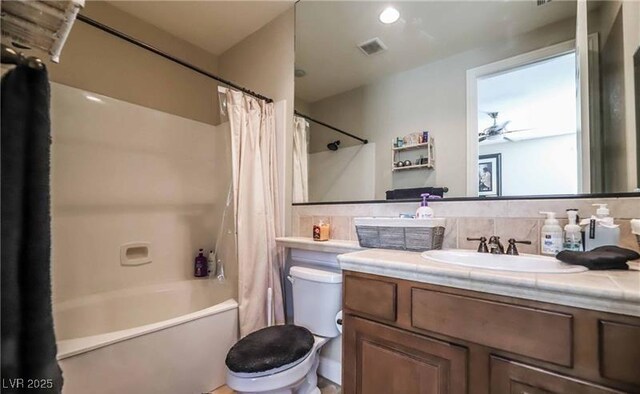 bathroom featuring shower / bath combo, visible vents, vanity, and toilet