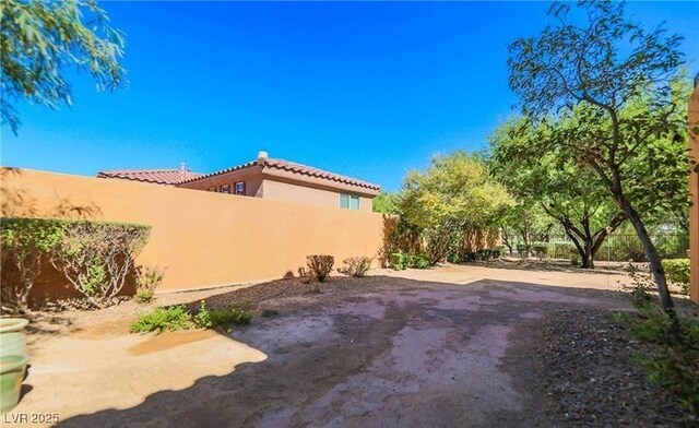 view of yard featuring a patio area and fence