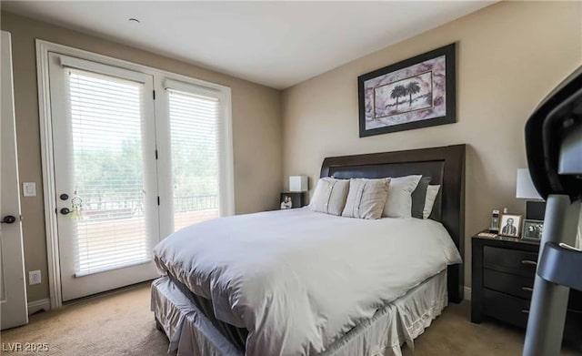 bedroom featuring light carpet, access to exterior, and baseboards