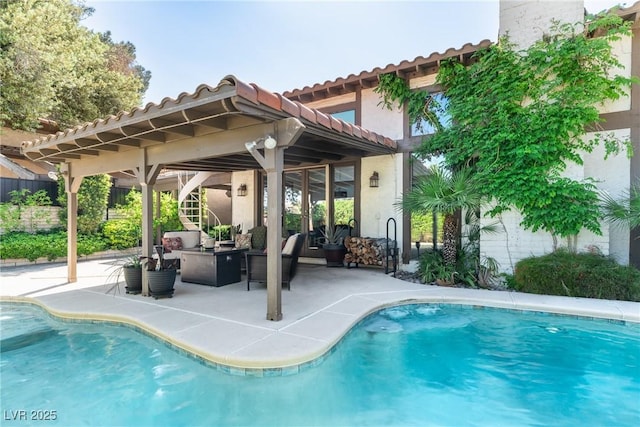 view of swimming pool with a patio area and an outdoor living space
