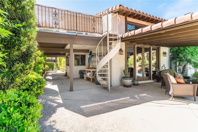 view of patio with stairway and french doors