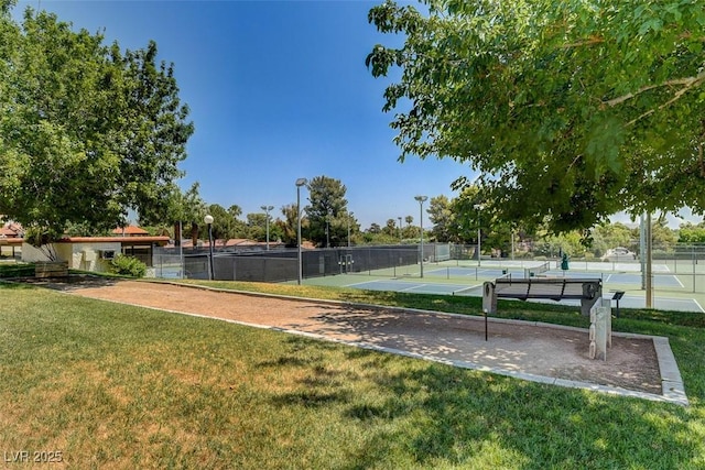 view of community featuring a tennis court