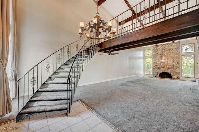 staircase with high vaulted ceiling, carpet, a chandelier, beamed ceiling, and baseboards