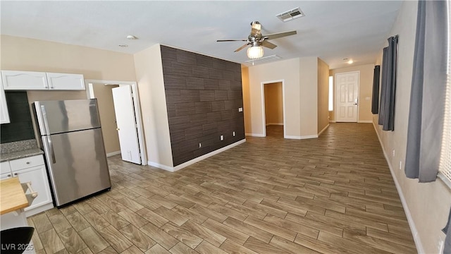 83 Rock Run St, Las Vegas, NV 89148 - kitchen featuring freestanding refrigerator, visible vents, baseboards, and ceiling fan