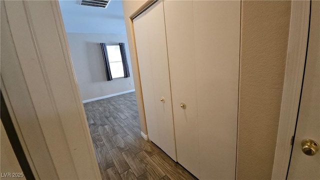 83 Rock Run St, Las Vegas, NV 89148 - hallway featuring baseboards, visible vents, and dark wood-type flooring