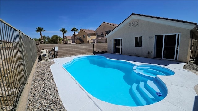 83 Rock Run St, Las Vegas, NV 89148 - view of swimming pool with a pool with connected hot tub, a patio, and a fenced backyard