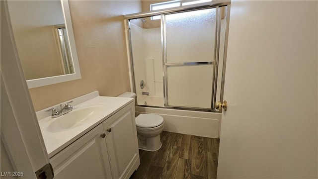 83 Rock Run St, Las Vegas, NV 89148 - bathroom featuring bath / shower combo with glass door, toilet, vanity, and wood finished floors