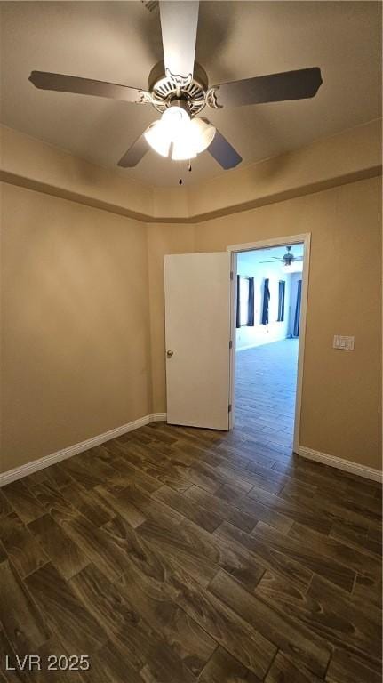 83 Rock Run St, Las Vegas, NV 89148 - unfurnished room featuring dark wood-type flooring, baseboards, and ceiling fan