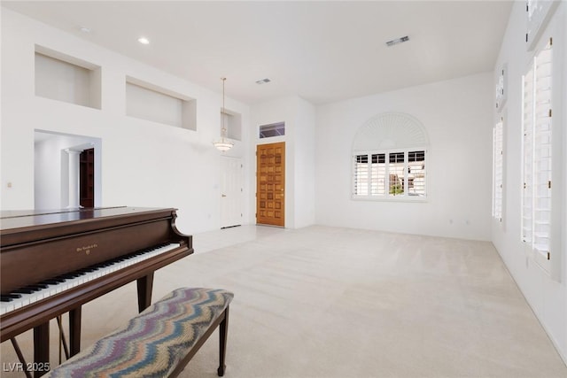 unfurnished room featuring carpet, recessed lighting, and visible vents