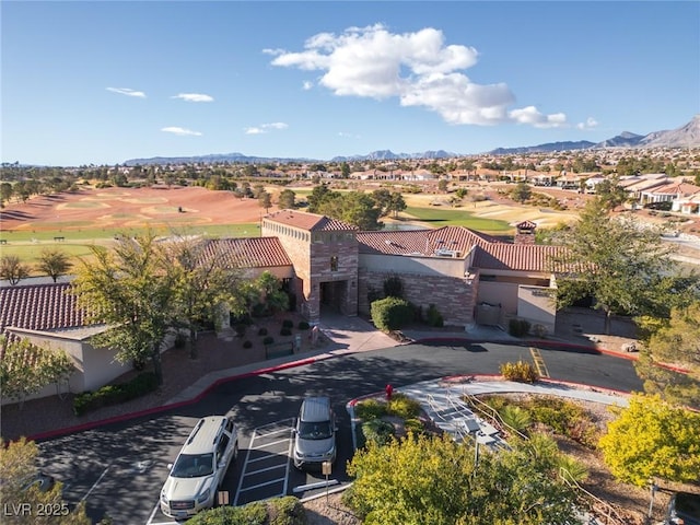 birds eye view of property featuring a mountain view, golf course view, and a residential view
