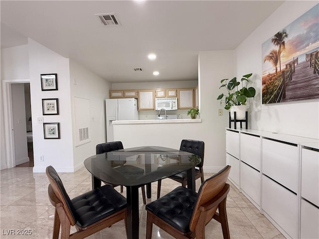 dining space featuring baseboards, recessed lighting, and visible vents