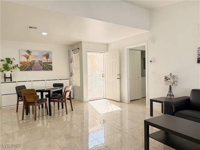 interior space featuring recessed lighting, baseboards, visible vents, and marble finish floor