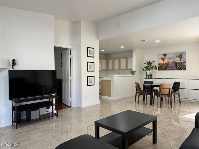 living area featuring baseboards, recessed lighting, marble finish floor, and visible vents