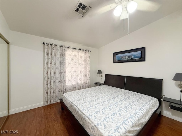 8452 Boseck Dr Unit 225, Las Vegas, NV 89145 - bedroom featuring vaulted ceiling, visible vents, wood finished floors, and baseboards