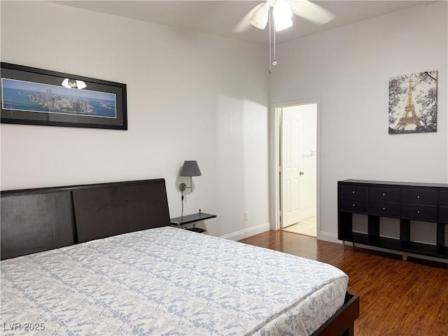 bedroom featuring baseboards and wood finished floors