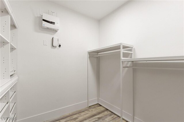 spacious closet with light wood finished floors