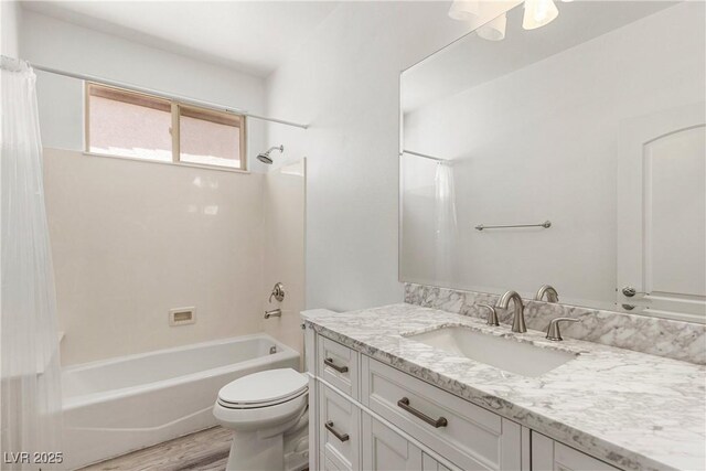 bathroom featuring shower / tub combo, vanity, toilet, and wood finished floors