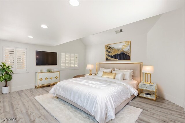 bedroom with recessed lighting, visible vents, wood finished floors, and baseboards