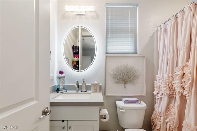 full bath with toilet and vanity