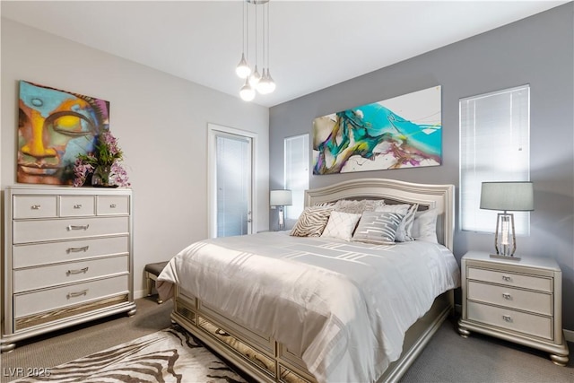 bedroom featuring carpet floors and baseboards