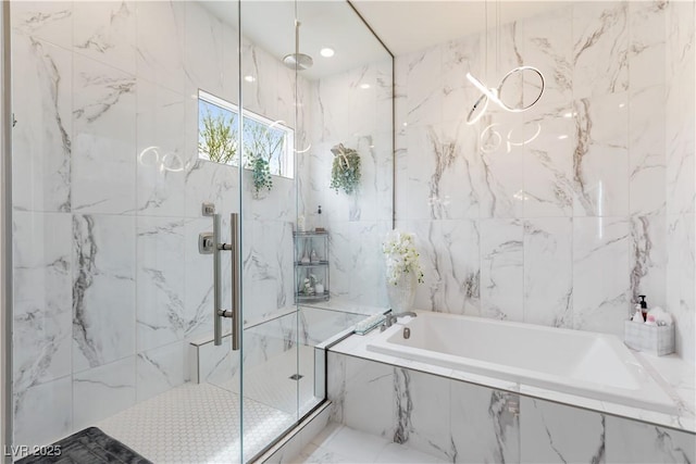 full bathroom featuring a bath, tile walls, and a marble finish shower