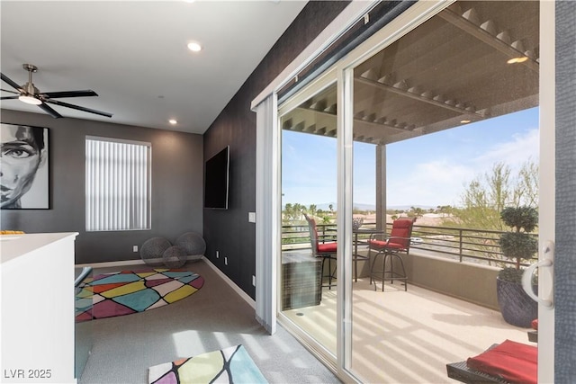 doorway with recessed lighting, a wealth of natural light, a ceiling fan, and baseboards