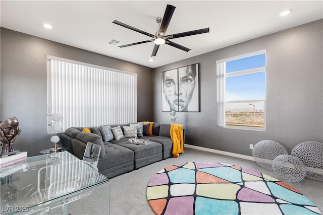 living area featuring carpet flooring, baseboards, visible vents, recessed lighting, and ceiling fan