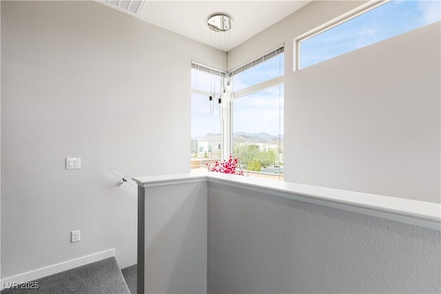 stairs featuring baseboards, visible vents, and carpet flooring