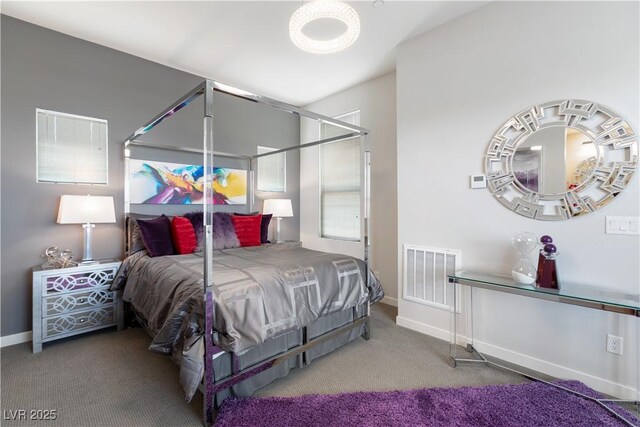 bedroom with carpet floors, visible vents, and baseboards