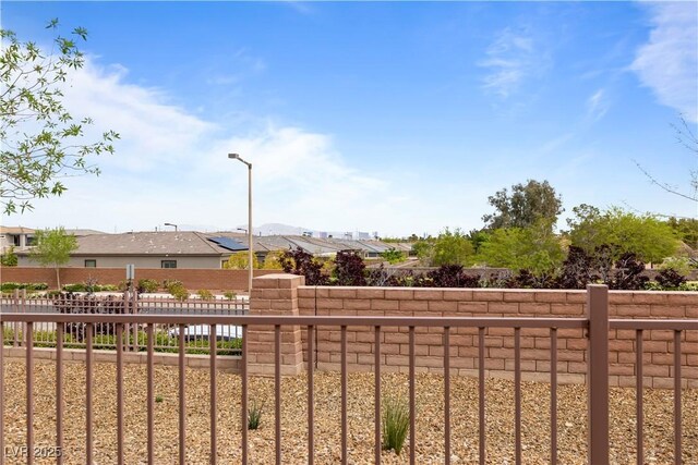 view of yard featuring a residential view and a fenced backyard