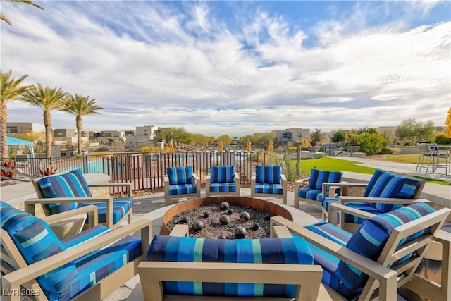 view of patio / terrace featuring an outdoor living space with a fire pit