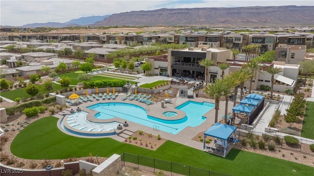 birds eye view of property with a mountain view and a residential view