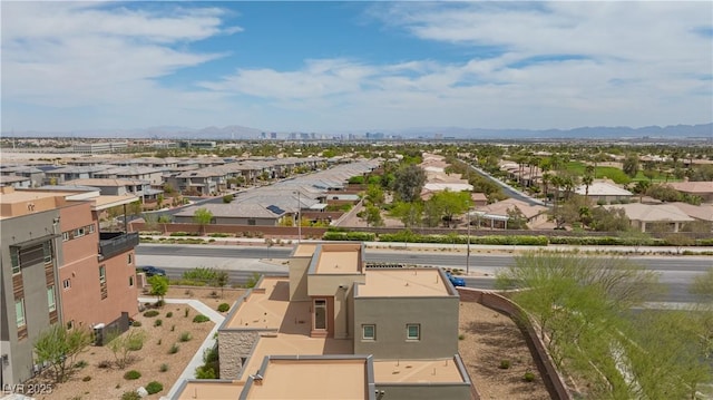 drone / aerial view with a residential view and a mountain view