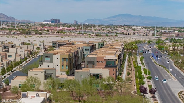 birds eye view of property featuring a mountain view