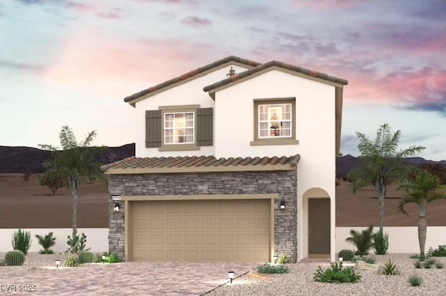 248 Kobuk Ave, Henderson, NV 89011 - view of front of home featuring a tile roof, driveway, stone siding, an attached garage, and stucco siding