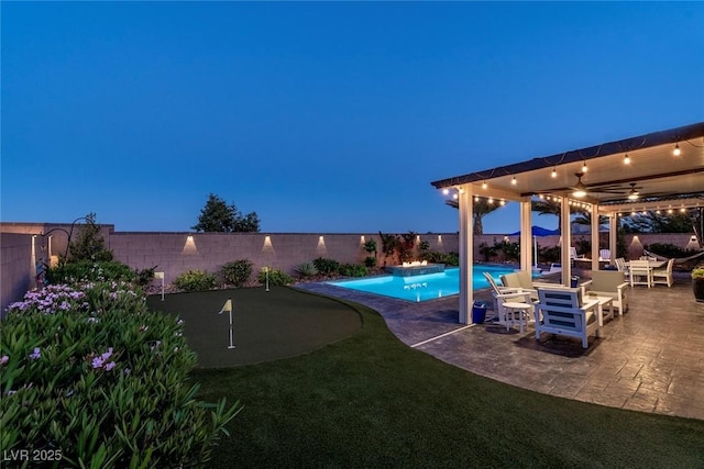 5852 Ireland Ridge Ct, Las Vegas, NV 89149 - view of pool with a putting area, ceiling fan, a fenced backyard, and a patio
