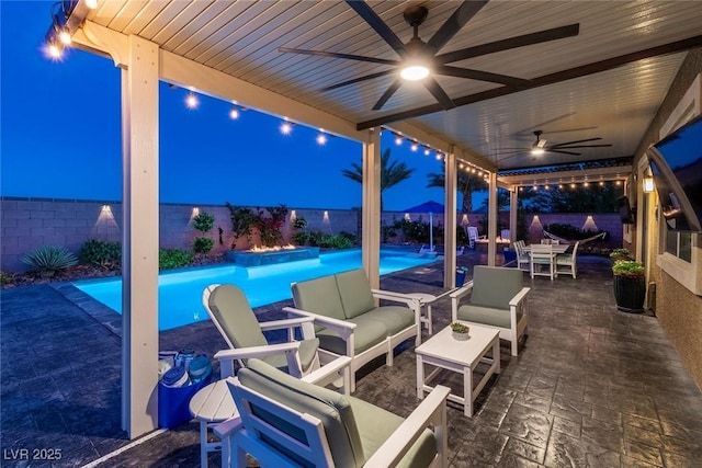5852 Ireland Ridge Ct, Las Vegas, NV 89149 - view of patio featuring a ceiling fan, a fenced backyard, and outdoor lounge area