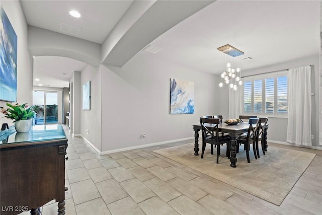 5852 Ireland Ridge Ct, Las Vegas, NV 89149 - dining area featuring plenty of natural light, arched walkways, baseboards, and recessed lighting