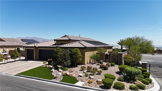 5852 Ireland Ridge Ct, Las Vegas, NV 89149 - view of front of property with stucco siding, an attached garage, fence, a tiled roof, and driveway