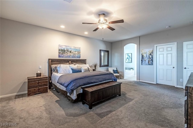 5852 Ireland Ridge Ct, Las Vegas, NV 89149 - carpeted bedroom featuring arched walkways, baseboards, recessed lighting, a ceiling fan, and ensuite bathroom